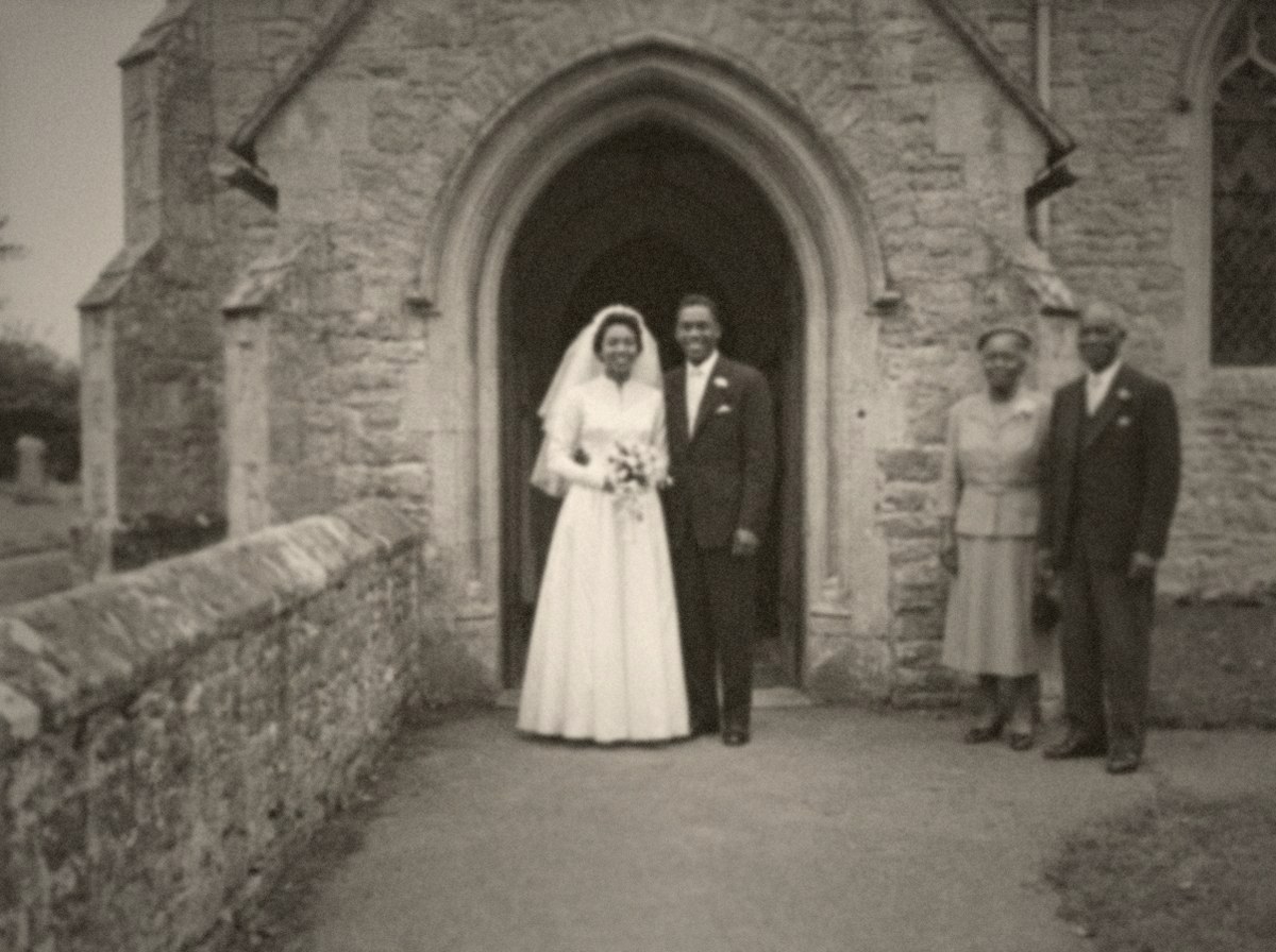 A black and white photograph from 1952 of a bride and groom in a church doorway, with her parents standing to one side.